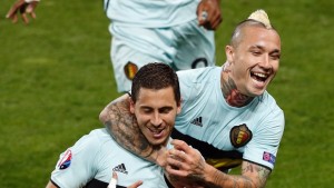 Belgium's captain Hazard is being celebrated by Nainggolan and team members.